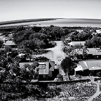 Kennedy Hill is a remote Aboriginal community in Broome in the north-west of Australia in the Kimberley. The community exists in the shadows of Western Australian premier Colin Barnett’s commitment to close down approximately 100-150 Aboriginal communities in Western Australia. There are more than 270 remote Indigenous communities in Western Australia and between them they are home to 12,000 people. Australian award winning Photojournalist Ingetje Tadros has spent four years working with the Aboriginal people and documenting the confronting daily life within the Aboriginal community. Her concerns for the community stretch from the old uninformed line that demonises Aboriginal men by insinuating that Aboriginal women and children are under great threat by the men in the communities to a lack of affordable accommodation while over seven per cent of the Kimberley population is homeless, and ninety per cent of this homelessness is comprised by its First Peoples.Aboriginal elders and leaders are shocked and feel this is a big threat to their people and believe the impact of such a move could be almost as devastating, forcing people out of the communities would just relocate and intensify underlying problems of poverty, disadvantage and unemployment. History is repeating itself! Much of the Kimberley is now under a regime of liquor restrictions, and some believe the drying up of Central and Eastern Kimberley towns has driven many of the most hardened and troubled alcoholics to Broome, where the booze continues to flow. So the problem of alcohol in smaller communities and the restrictions has moved the problem to the larger centres.  The hill is significant to indigenous people in the region and the presence of a large shell midden immediately adjacent to the community is testament to this significance. It’s been a living area since before white occupation or colonisation....since time immemorial. Now the question remains, which Aboriginal communities will be closed? Personal quotes:  “Somehow I feel it’s all becoming a very slow genocide for the Aboriginal People, they are the Original people of Australia, this is their Land, their Country." Taking Country away from people is like committing spiritual genocide for they will be forever lost. My good friend Katja Nedoluha wrote: To Aboriginal people, losing Country is not just like losing a home in the sense of losing a roof over your head. Losing Country is losing the connection to everything that ties them and is tied to that Country; Community, language, kin, Law, culture. Aboriginal people belong to their Country just like your breath belongs to you. Country sustains them. Countrymen and women are the blue print of their land and carry its stories, law, culture in their physical embodiment."  “I’ve always been appalled by the way the Aboriginal people were treated and it just disturbed and disgusted me, so I decided to have a closer look and started mingling with Aboriginal people about four years ago, at first I spent time in the little bush camps where they were carving boab nuts and where they were eating and drinking, I started taking portraits and from day one I’ve given the images back, which were always received with a big smile, that was my reward, the smiles on their faces, so we started a relation and that whole relation become more stronger and intense , than I started documenting daily life like funerals, hunting, family fights, a wedding and little family moments. Than over six months ago I felt the need to document just one Community, and that became Kennedy Hill.” Why? First of all I was appalled that people are living in such poverty in Australia, which is such a rich country, people living in very old and un- maintained houses and this all in Broome, a tourist mecca where people fly in from all over the world to enjoy this beautiful place, the  Community of  Kennedy Hill seems a different planet and it’s sits on a pristine real estate and I was just annoyed about the negativity about Aboriginal people, as I always say ‘ when there are different cultures living together, you should sit with one another and learn from each other and respect each other’s cultures and ways, this is the only way forward.” Myself I am Dutch and am married with an Egyptian, I decided to live in Egypt for one year and my husband lived also in Holland, our marriage still stands, now 30 yrs married,  as we have embraced each other’s culture and understand each other culture, than it will be sustainable.”  “I wanted to get to know the people in Kennedy Hill and spent 6 months to document their life, the people opened their homes for me and started sharing their frustrations and their problems.”  “Many Aboriginal people are appalled and shocked by the decision of the Premier of Western Australia —Colin Barnett - about his decisions to close at least 100 communities in Western Australia.”  “I’ve learned so much from the Countryman and women, their relationship within their families, the strong family ties, to know who they are and know where the come from, it identifies them, in my own culture this does not exist.” “My last remark is that the only way to learn from each other is to sit with each other , respect and understanding go a long way, and that is what I have found and I can say from the bottom of my heart that Aboriginal people are the kindest and warmest people, who are very welcoming and have the best humour and it saddens me when I hear, over and over again, ‘they just have to go over it’, as my reply to statements like these is, ‘what about if all what happened to them, would ‘ve happened to you and your family’, would you and your family ‘just get over it?”